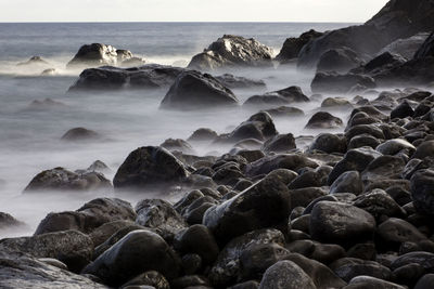 Scenic view of rocky sea shore