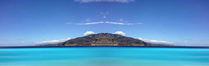 Scenic view of sea against blue sky