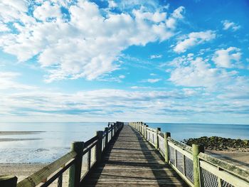 Pier over sea against sky