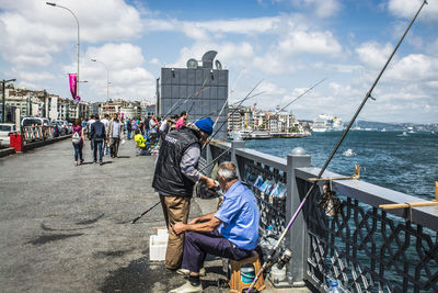 People fishing at sea