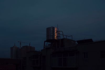 Low angle view of buildings against sky at dusk