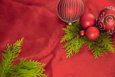 Close-up of christmas decoration on red fabric