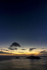 Scenic view of sea against sky at sunset