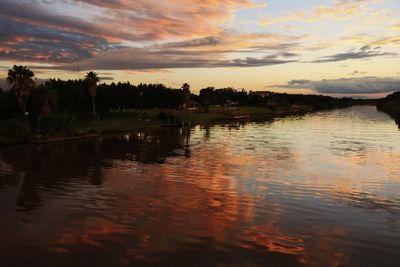 Scenic view of lake against sky during sunset