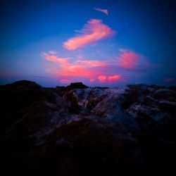 Scenic view of landscape against sky at sunset