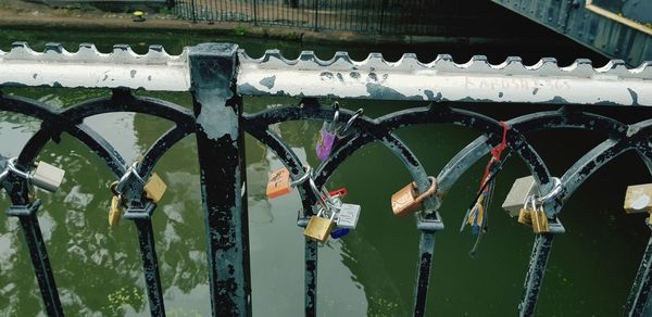 View of padlocks on bridge