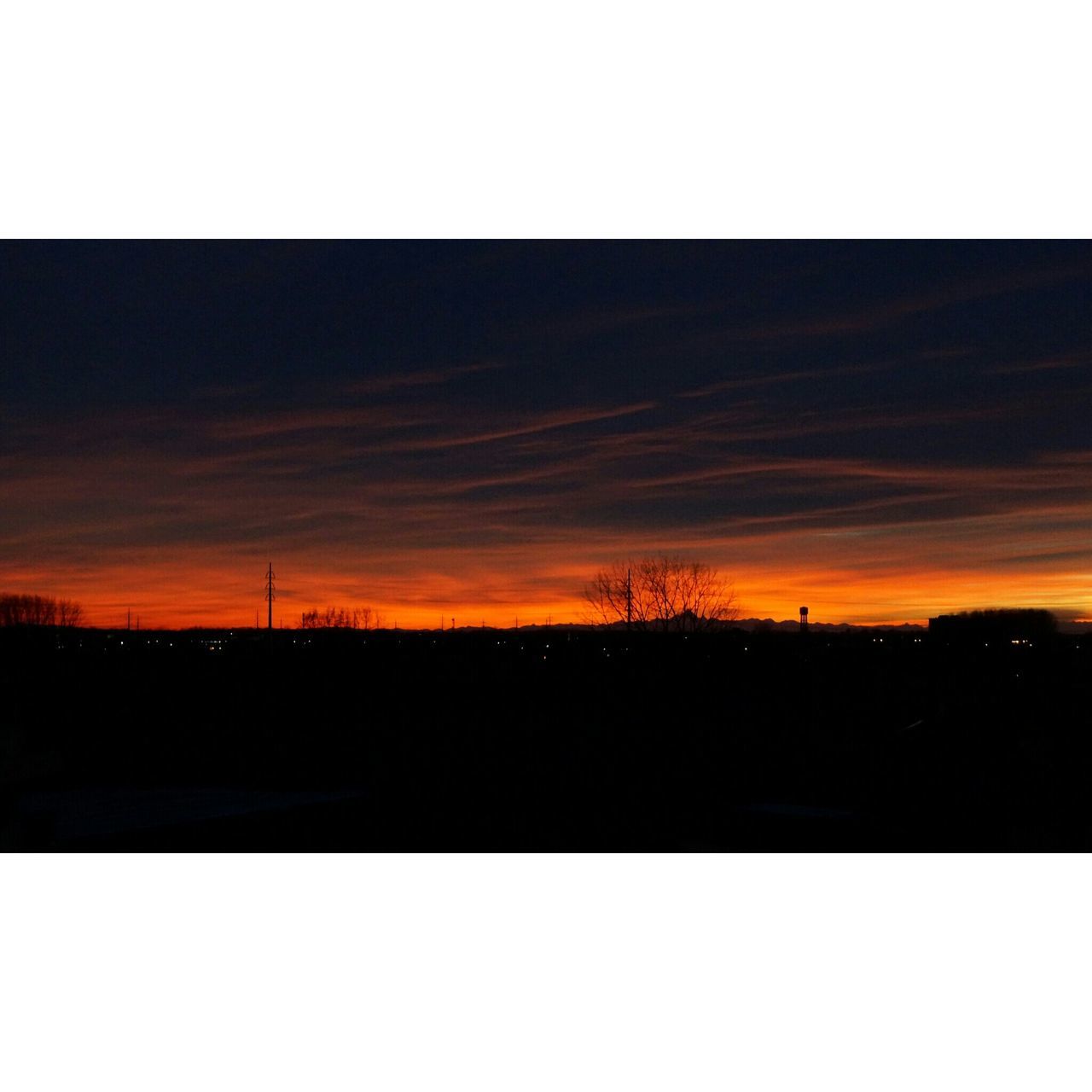 sunset, transfer print, silhouette, auto post production filter, sky, orange color, scenics, tranquil scene, beauty in nature, tranquility, nature, dark, cloud - sky, landscape, idyllic, dusk, copy space, outdoors, no people, sun