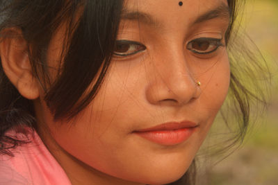 Close-up of teenage girl face outdoors