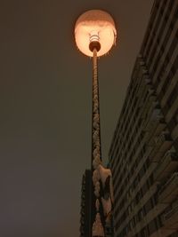 Low angle view of skyscrapers lit up at night