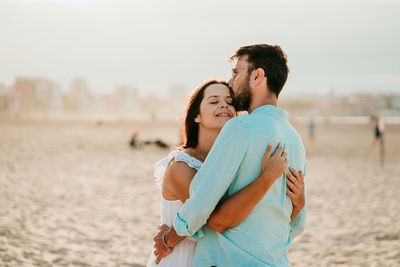 Young couple kissing in water