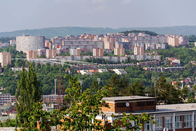 High angle view of trees and buildings against sky