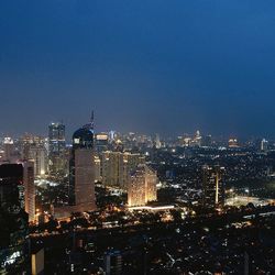 Illuminated cityscape at night