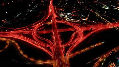 High angle view of light trails on highway at night