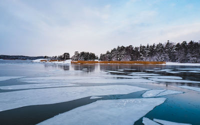 Scenic view of sea against sky in winter