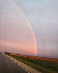 Scenic view of rainbow over field