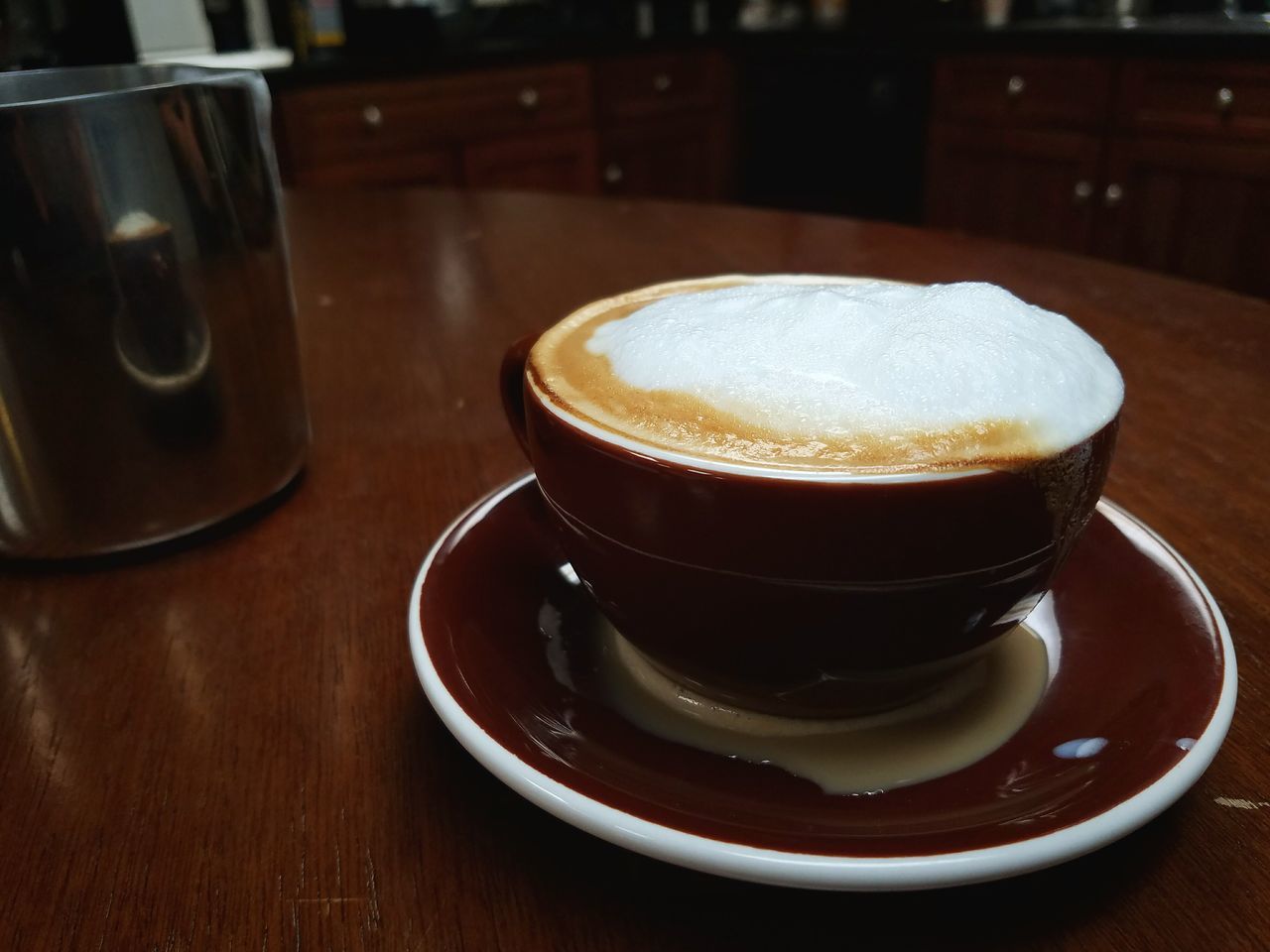 HIGH ANGLE VIEW OF COFFEE CUP ON TABLE