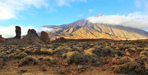 View of landscape against cloudy sky