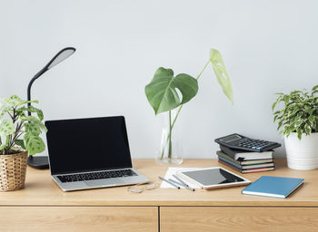 Office workplace with laptop on wooden table