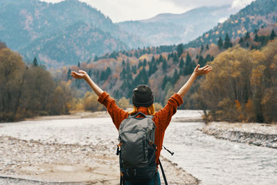 Rear view of man looking at mountains