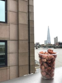 Close-up of food on table in city