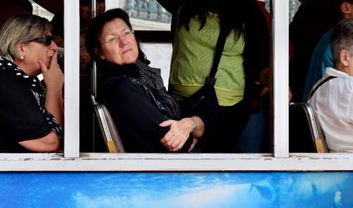 Thoughtful woman traveling in bus