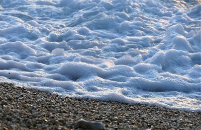 High angle view of surf on beach