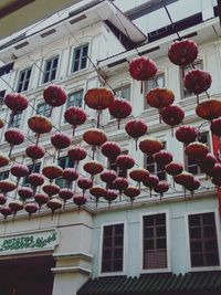 Low angle view of lanterns hanging outside building