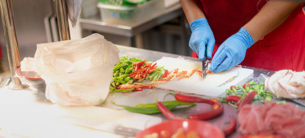 Midsection of woman preparing food