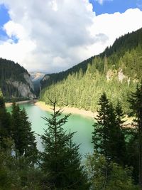 Scenic view of lake and mountains against sky