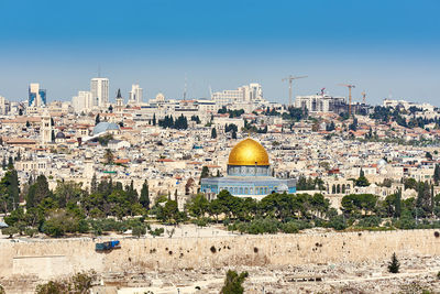 Dome of the rock in city against sky