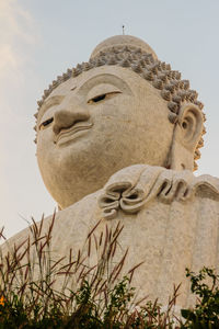 Low angle view of statue against sky