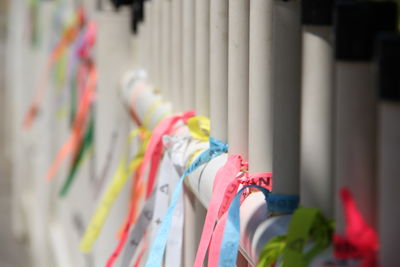 Close-up of multi colored decorations hanging in row