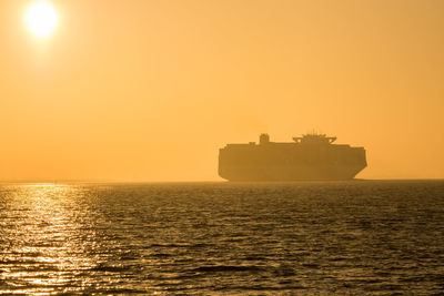 Scenic view of sea against clear sky during sunset