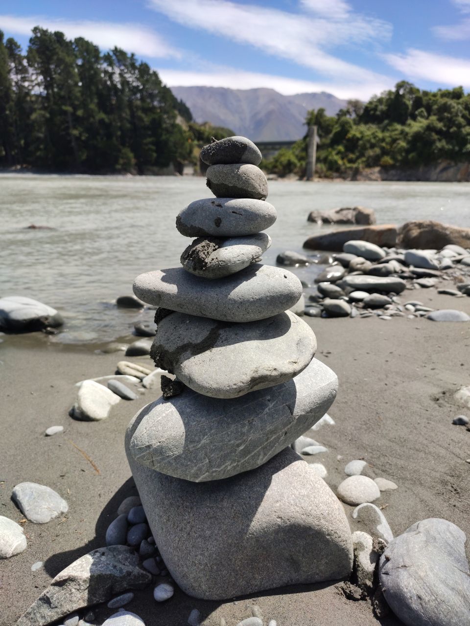 stack, balance, rock, solid, stone - object, stone, pebble, zen-like, nature, rock - object, tranquility, beach, land, day, sunlight, sky, stability, water, no people, focus on foreground, outdoors