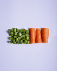 Close-up of chopped vegetables against white background