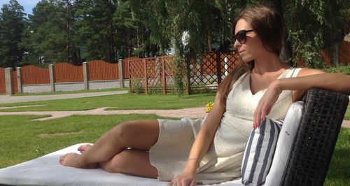 Young woman wearing sunglasses at park