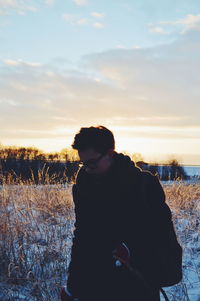 Silhouette of woman at sunset