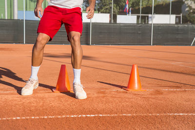 Low section of man playing on field