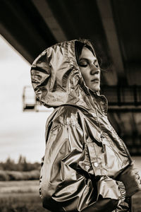 Portrait of young woman standing outdoors