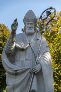 Low angle view of statue against sky