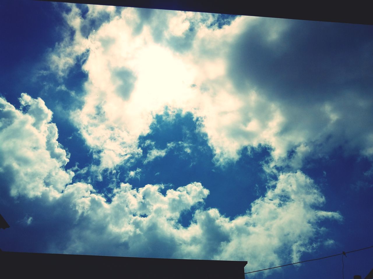 sky, low angle view, cloud - sky, cloudy, cloud, blue, beauty in nature, nature, scenics, tranquility, transfer print, cloudscape, tranquil scene, auto post production filter, outdoors, no people, day, weather, high section, idyllic