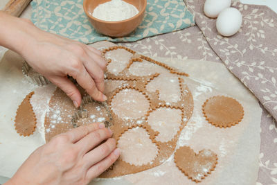 High angle view of woman preparing food on table