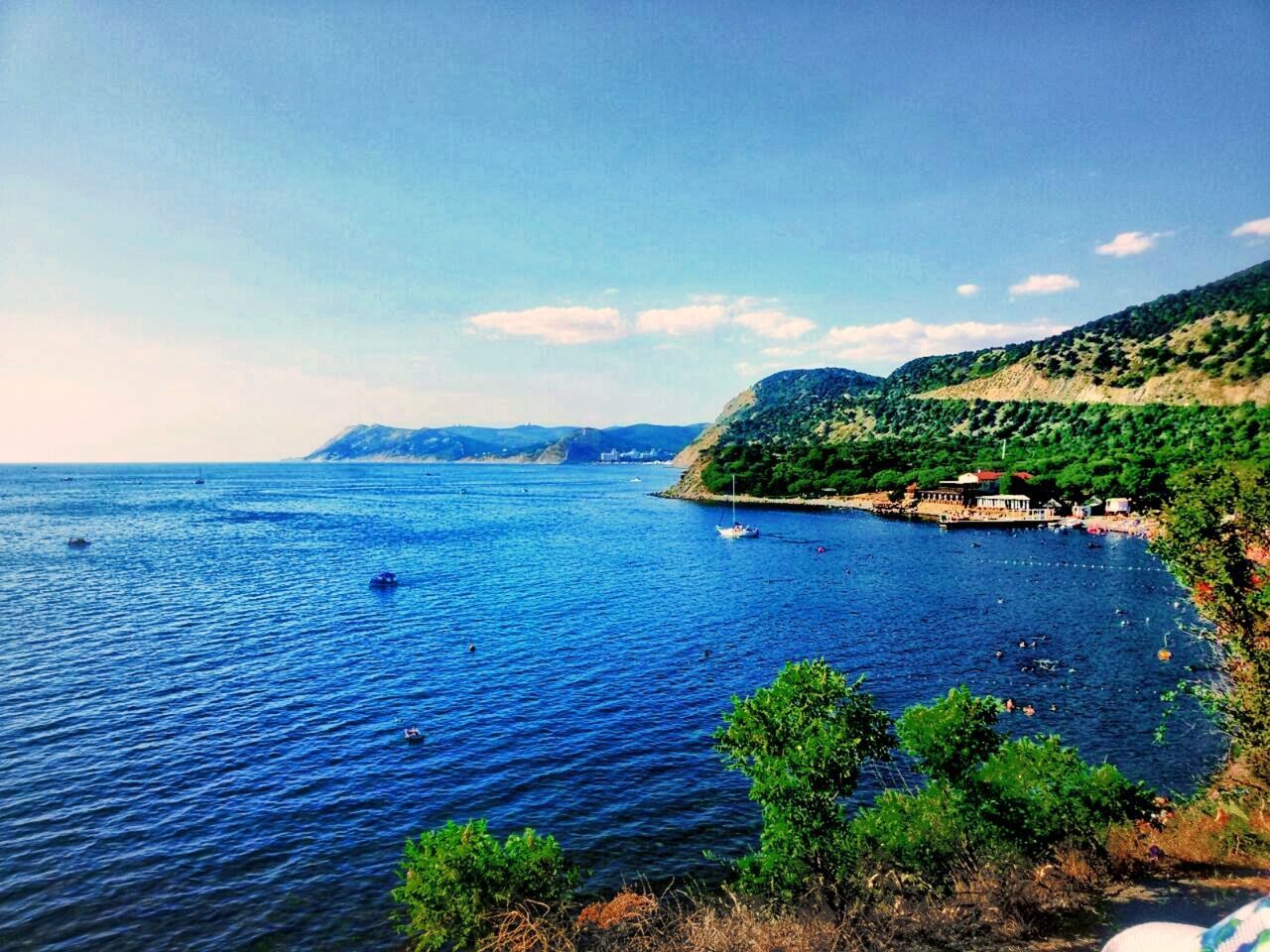 SCENIC VIEW OF BAY AGAINST CLEAR BLUE SKY