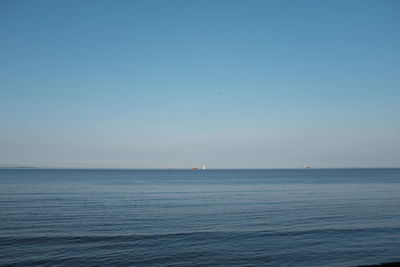 View of calm blue sea against clear sky