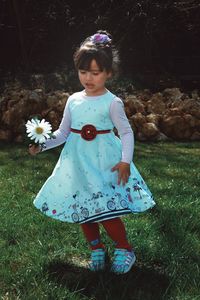 Full length of girl standing on field