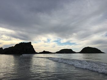 Scenic view of seascape against cloudy sky