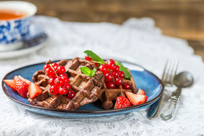 Close-up of strawberries in plate on table