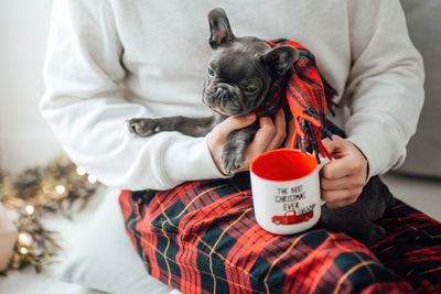 Midsection of woman with dog