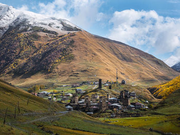 Scenic view of mountains against cloudy sky