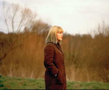 Young woman standing on field